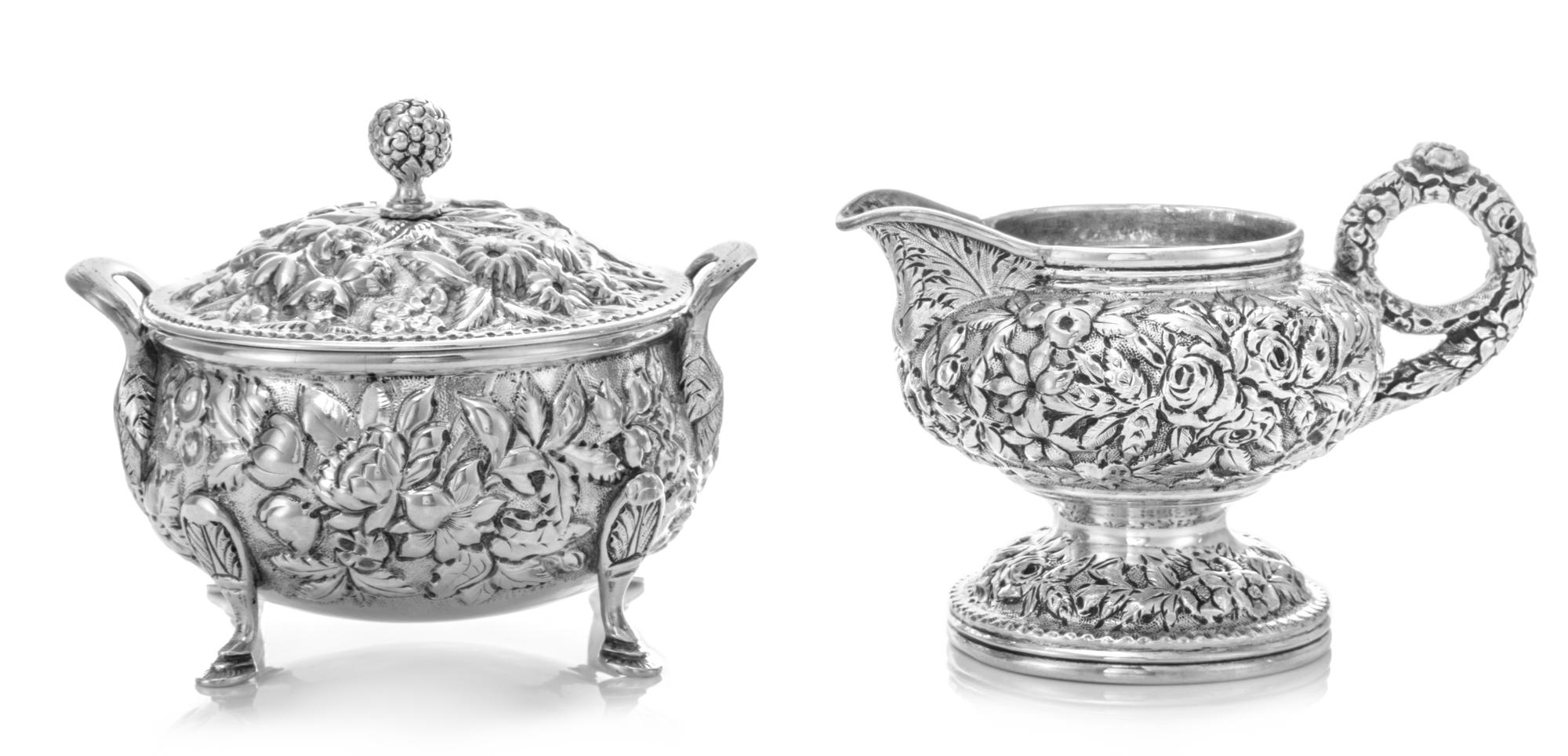 An American Silver Creamer and Covered Sugar, S. Kirk & Son, Baltimore, MD, each worked with repousse floral and foliate decoration, th
