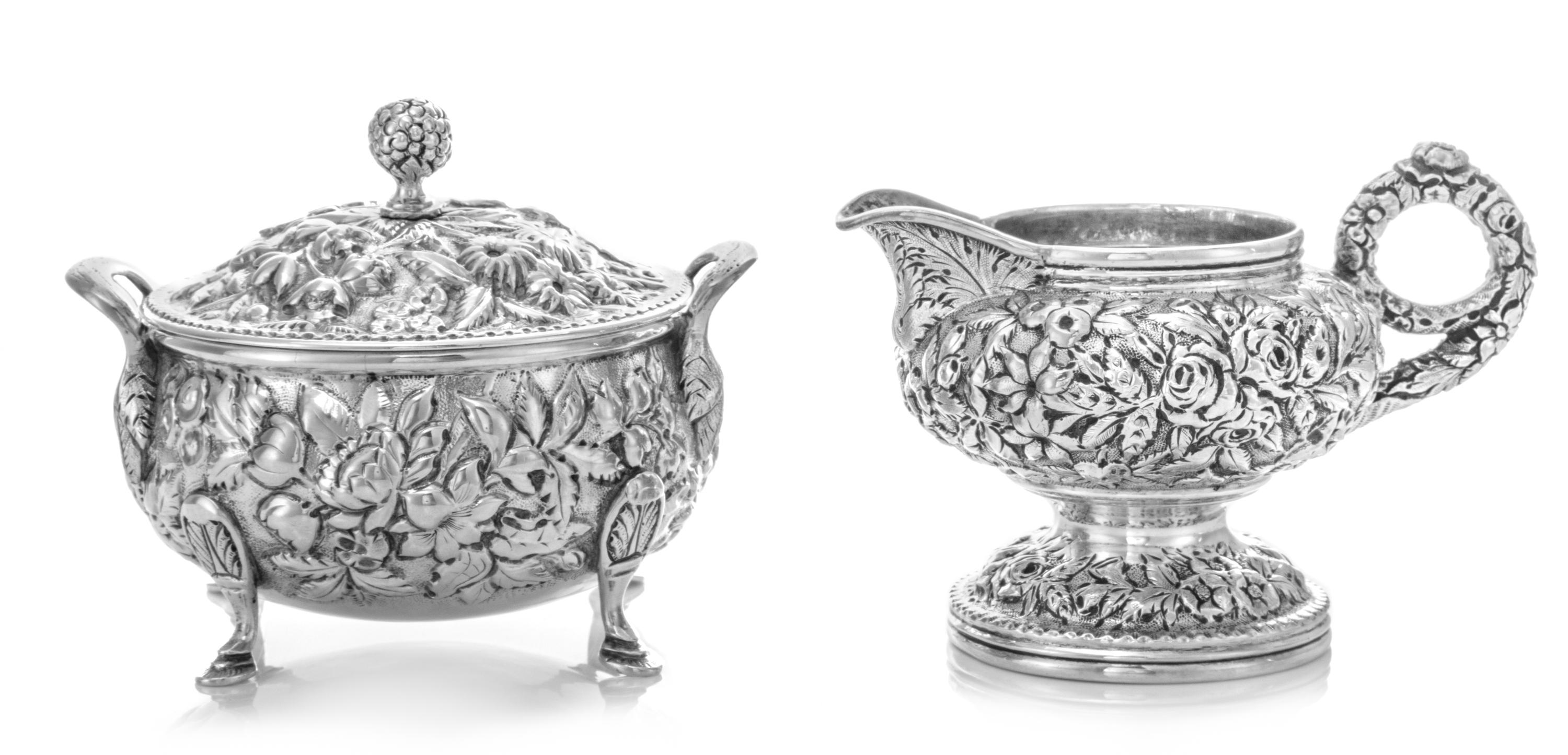 An American Silver Creamer and Covered Sugar, S. Kirk & Son, Baltimore, MD, each worked with repousse floral and foliate decoration, th