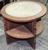 A Carved Hardwood and Leather Inset Drum Table, likely African Height 23 1/2 x diameter 30 inches. — MID 20TH CENTURY