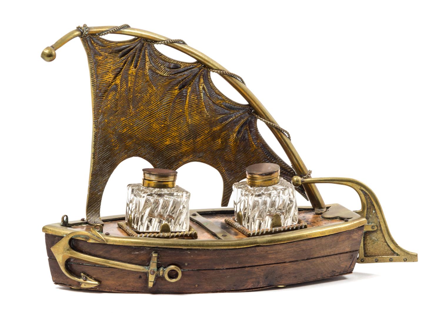 An English Brass Mounted Walnut Boat-Form Standish Height 8 3/4 inches. — 19TH CENTURY