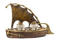 An English Brass Mounted Walnut Boat-Form Standish Height 8 3/4 inches. — 19TH CENTURY