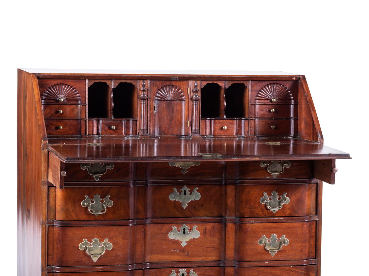A Chippendale Carved and Figured Mahogany Block-Front Slant-Front Desk
