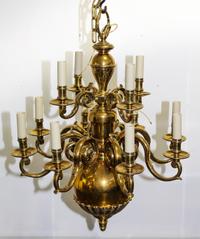 A Dutch Baroque Style Brass Twelve Light Chandelier Diameter 28 3/4 inches.