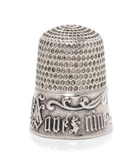 An American Silver Thimble, Simons Bros., Philadelphia, PA, the based marked A Stitch in Time Saves Nine with a vacant cartouche framed