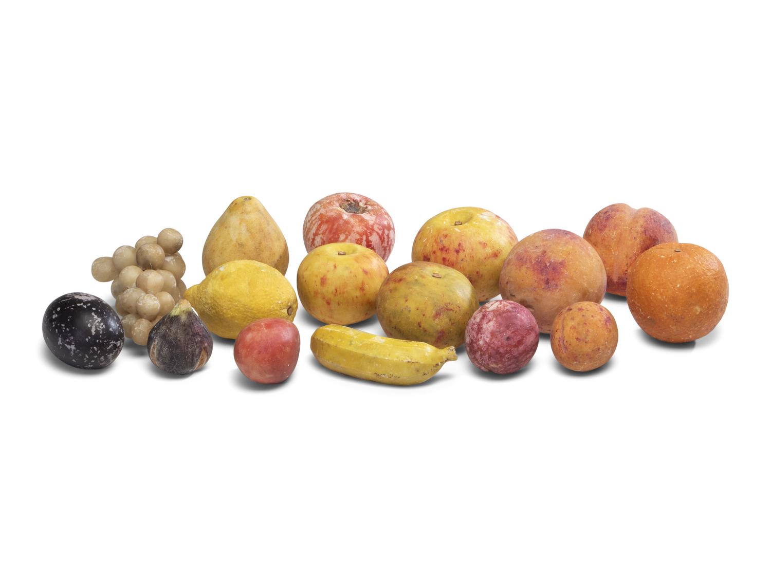 A Group of Carved and Painted Stone Fruit