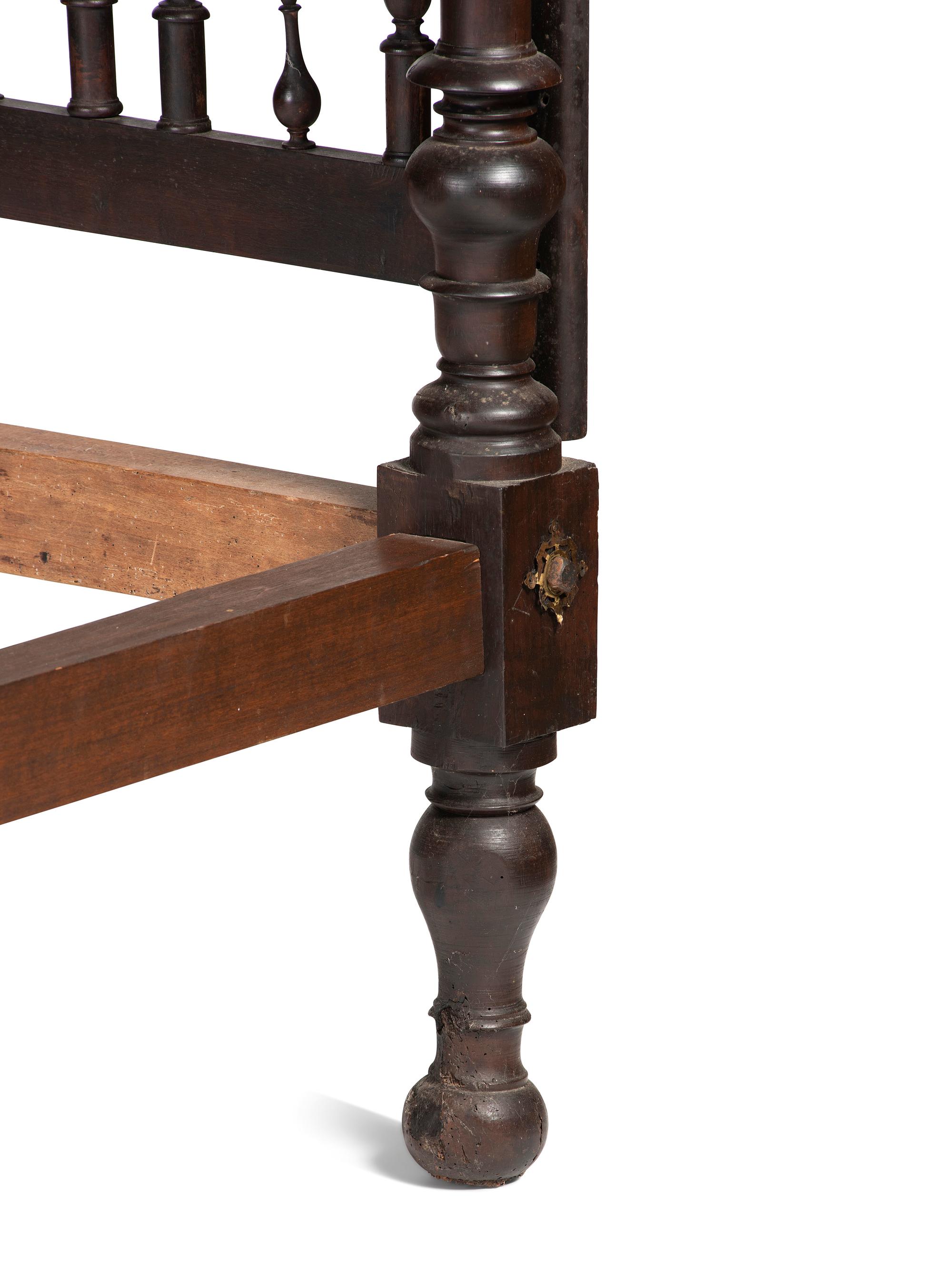 A Gothic Revival Walnut Four Poster Bed