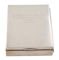 An American Silver Cigarette Case, Cartier, New York, NY, inscribed New England Circuit/Polo Championship/1927/Won by; having a gilt wa