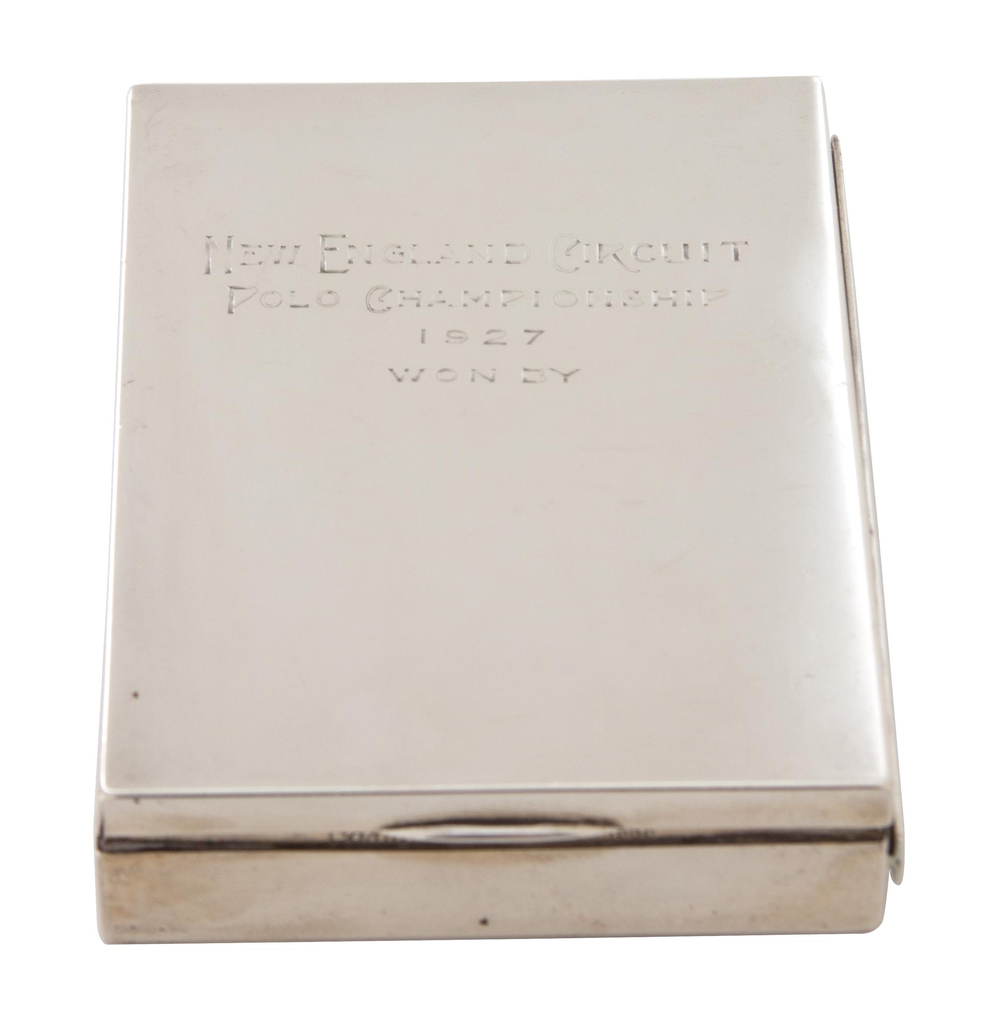 An American Silver Cigarette Case, Cartier, New York, NY, inscribed New England Circuit/Polo Championship/1927/Won by; having a gilt wa