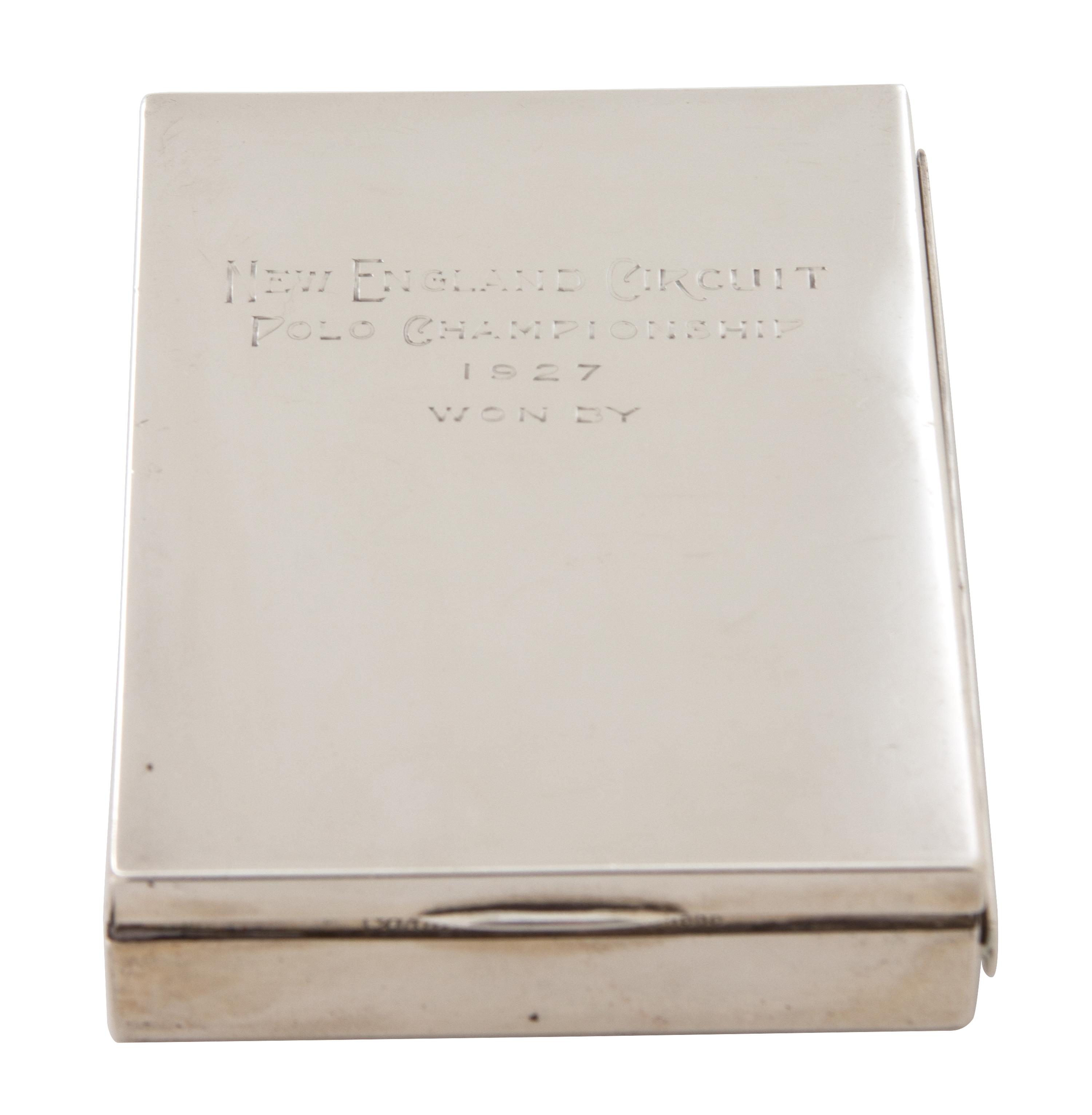 An American Silver Cigarette Case, Cartier, New York, NY, inscribed New England Circuit/Polo Championship/1927/Won by; having a gilt wa