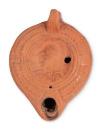 Ten Roman Terracotta Oil Lamps and a Holy Land Pottery Jug