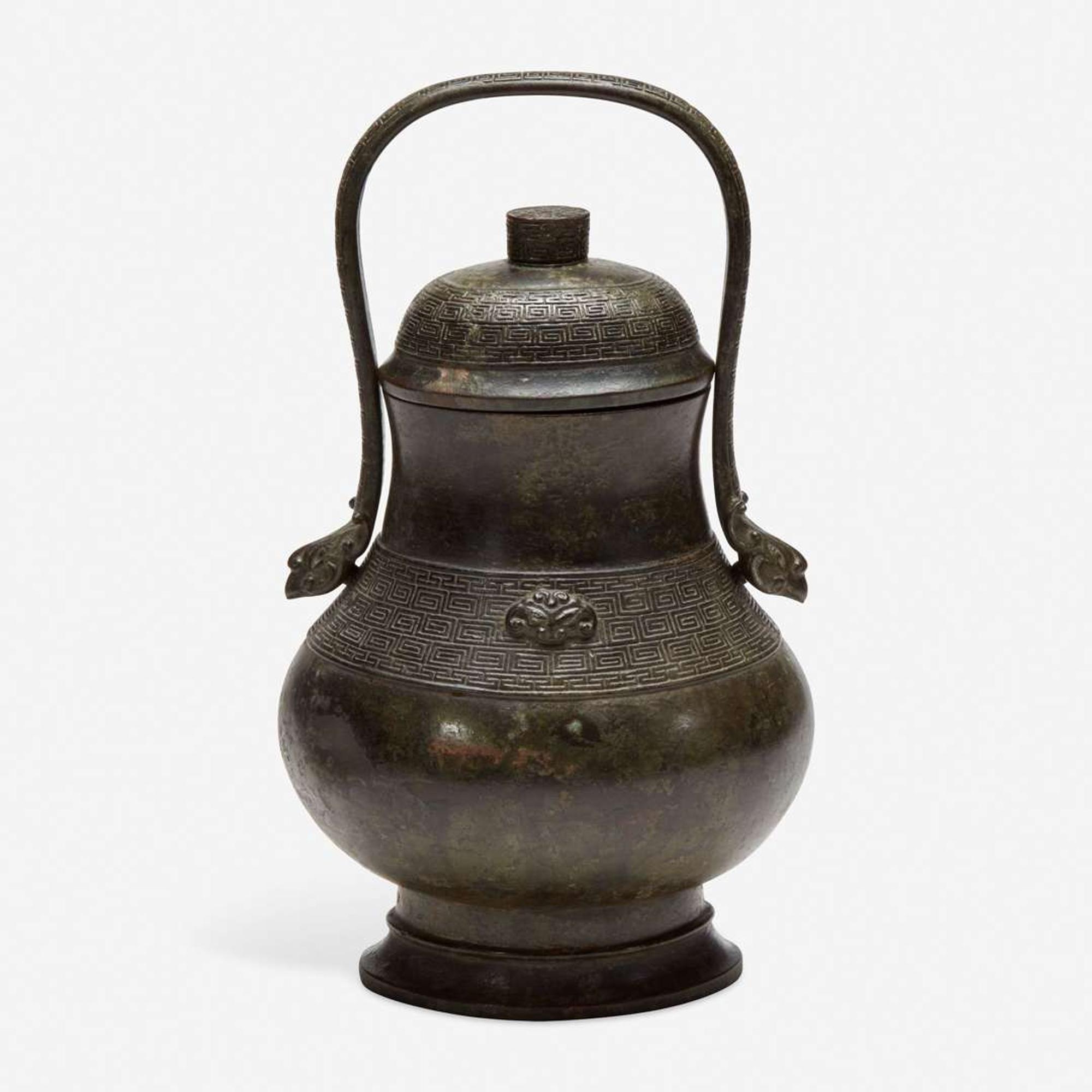 A Chinese archaistic patinated bronze covered wine vessel, you 倣古风格卣 late Ming/Qing dynasty ?????