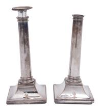 A Pair of Sheffield Plate Columnar Candlesticks and a Set of Four English Silverplate Candlesticks
