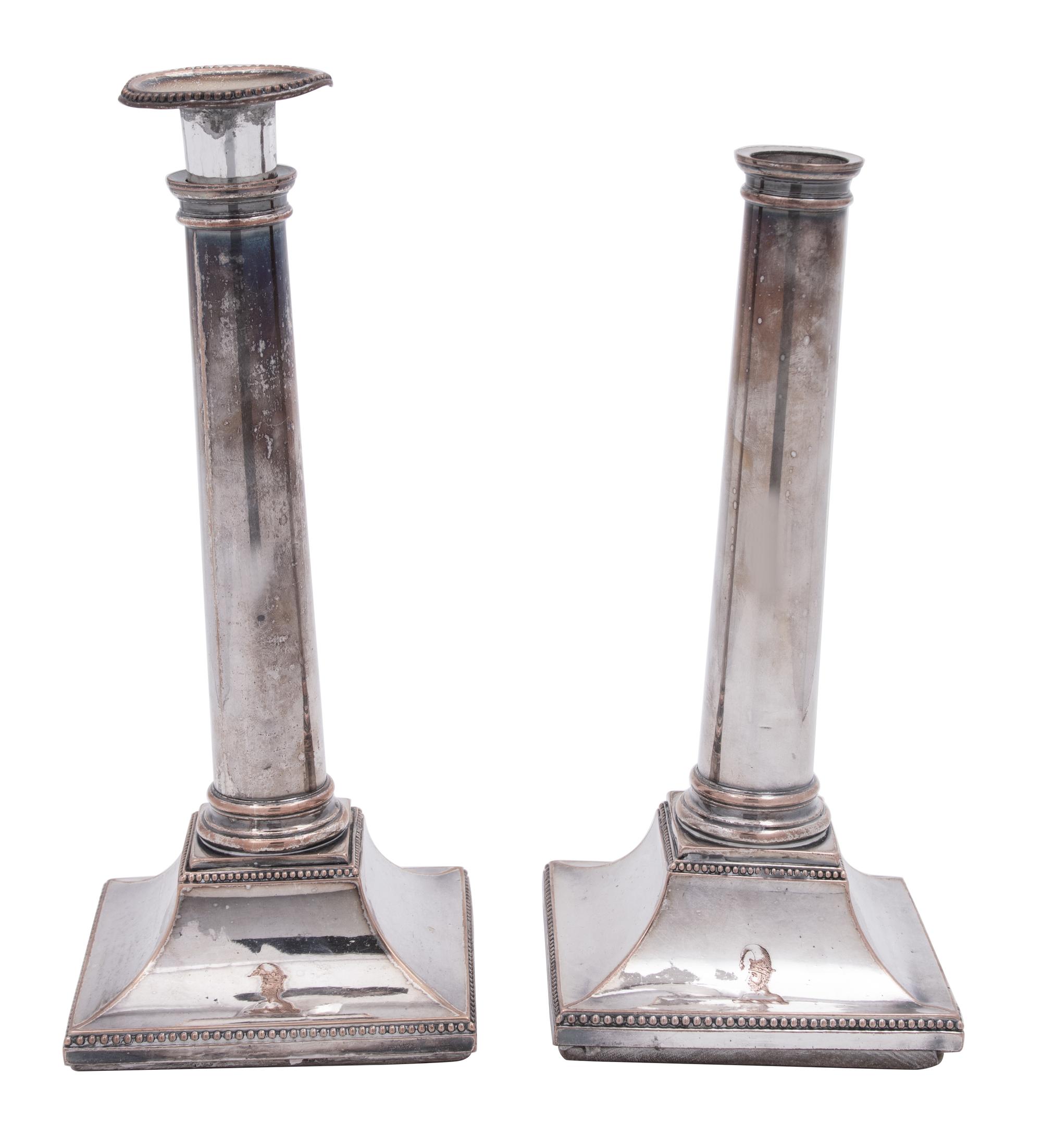 A Pair of Sheffield Plate Columnar Candlesticks and a Set of Four English Silverplate Candlesticks
