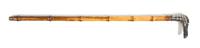A Silvered Metal Mounted Cane, Height overall 34 1/2 x width of handle 4 3/4 inches.