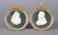 A Group of Two Continental Carved Ivory Portrait Plaques, Height of ivory 2 3/4 inches.