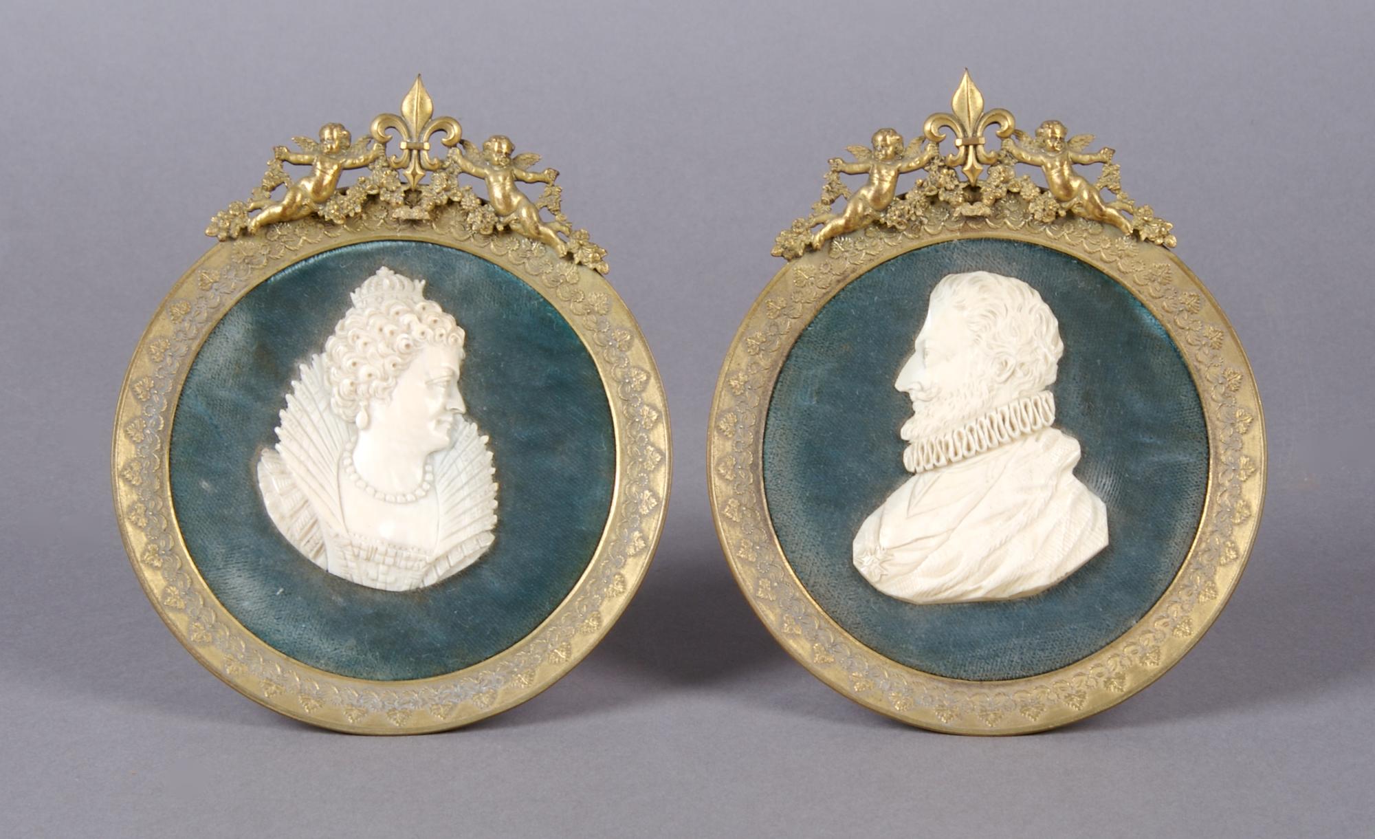 A Group of Two Continental Carved Ivory Portrait Plaques, Height of ivory 2 3/4 inches.