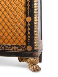 A Regency Style Parcel Gilt and Ebonized Penwork Cabinet