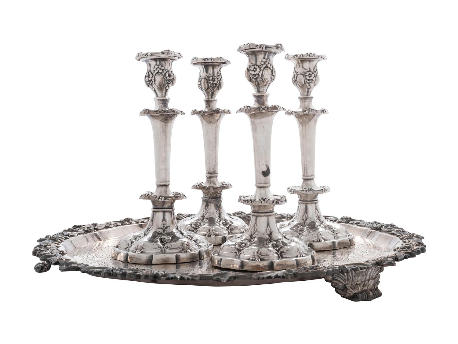 Four Silverplated Weighted Candlesticks and a Silverplated Tray