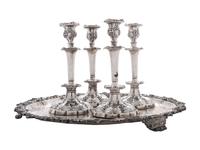 Four Silverplated Weighted Candlesticks and a Silverplated Tray
