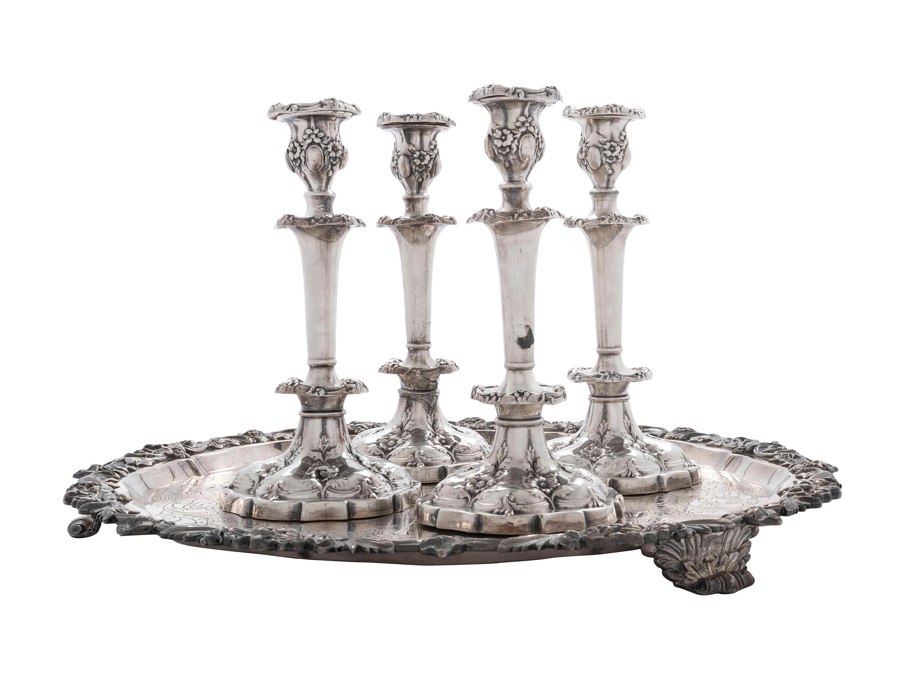 Four Silverplated Weighted Candlesticks and a Silverplated Tray