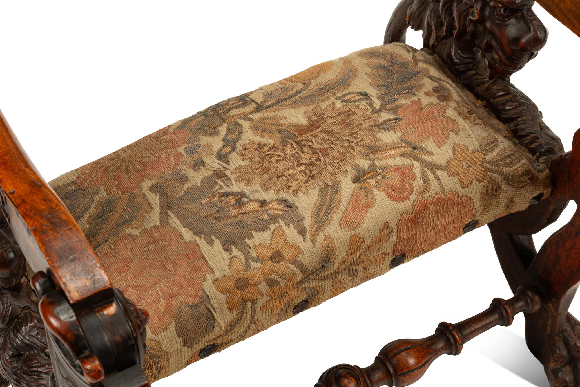 An Italian Carved Walnut Low Armchair