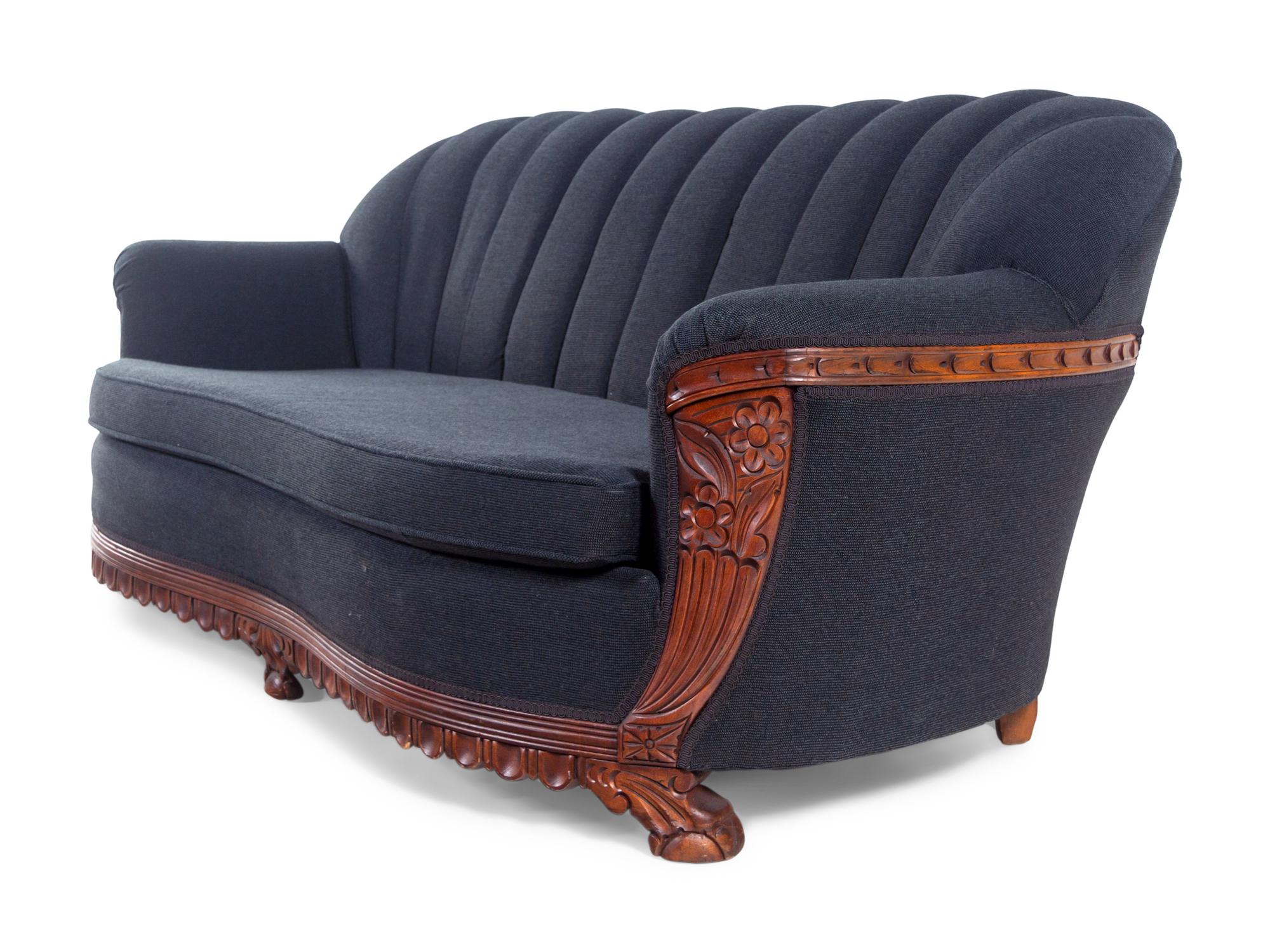 An Art Deco Style Carved Walnut Sofa and Armchair