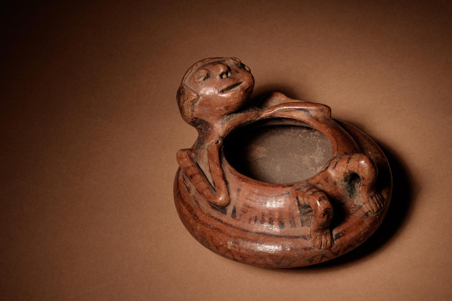 A Narino Terracotta Vessel of a Lying Man