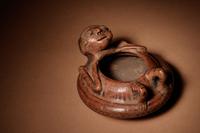 A Narino Terracotta Vessel of a Lying Man