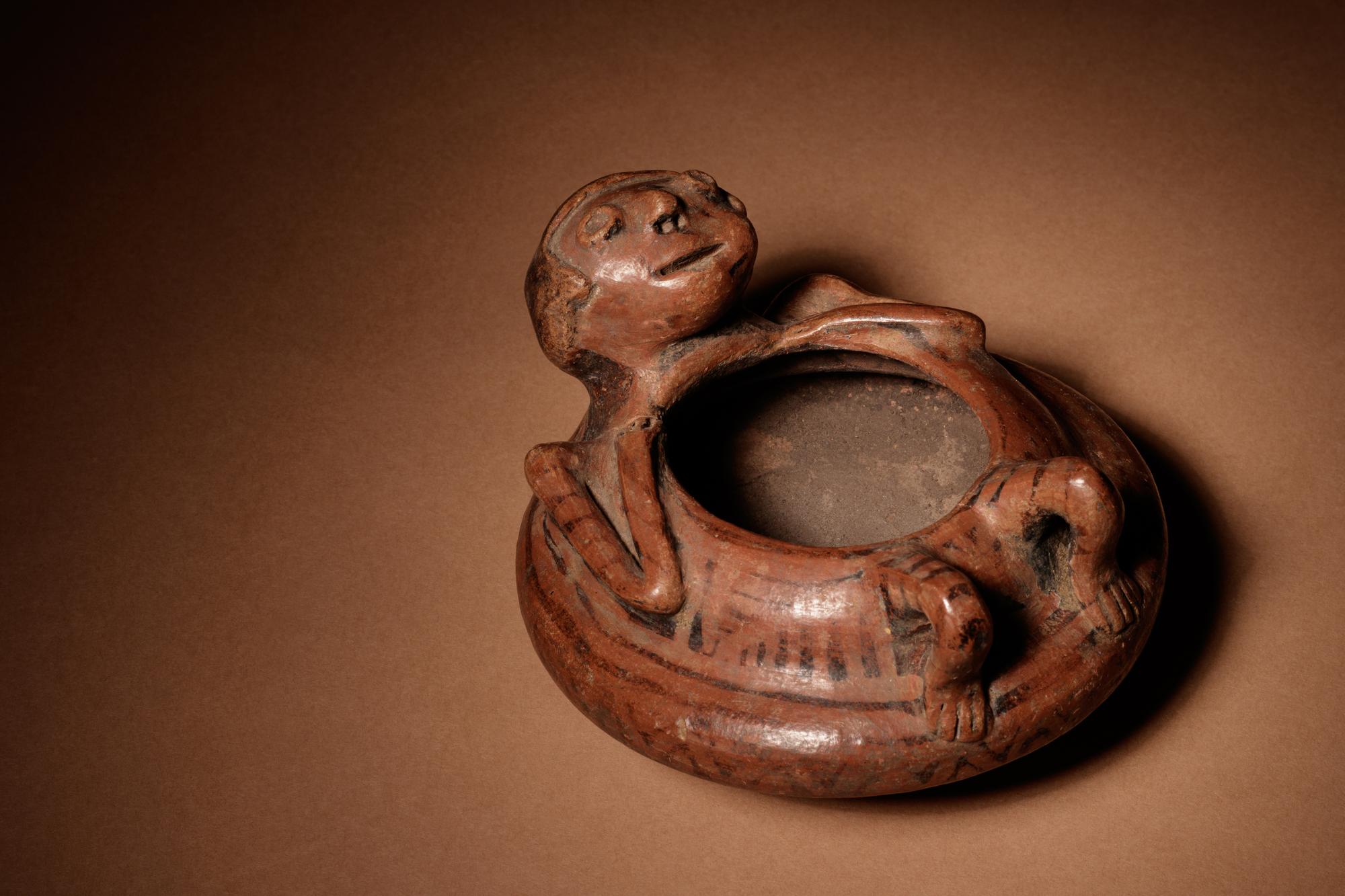 A Narino Terracotta Vessel of a Lying Man