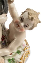 A Pair of Meissen Porcelain Figural Candlesticks