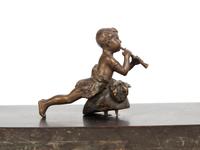 An Empire Style Gilt Metal and Alabaster Mounted Ebonized Clock