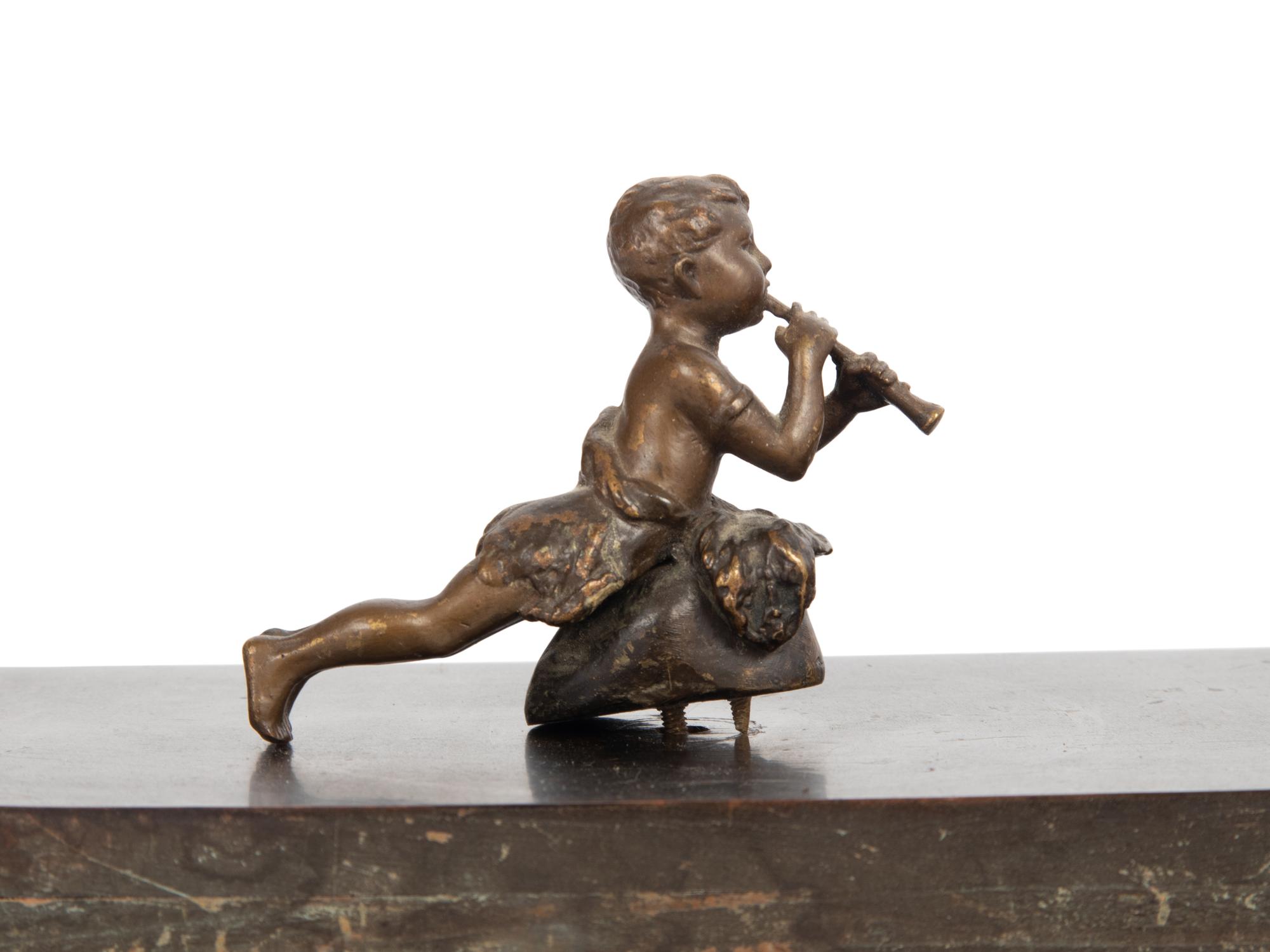 An Empire Style Gilt Metal and Alabaster Mounted Ebonized Clock