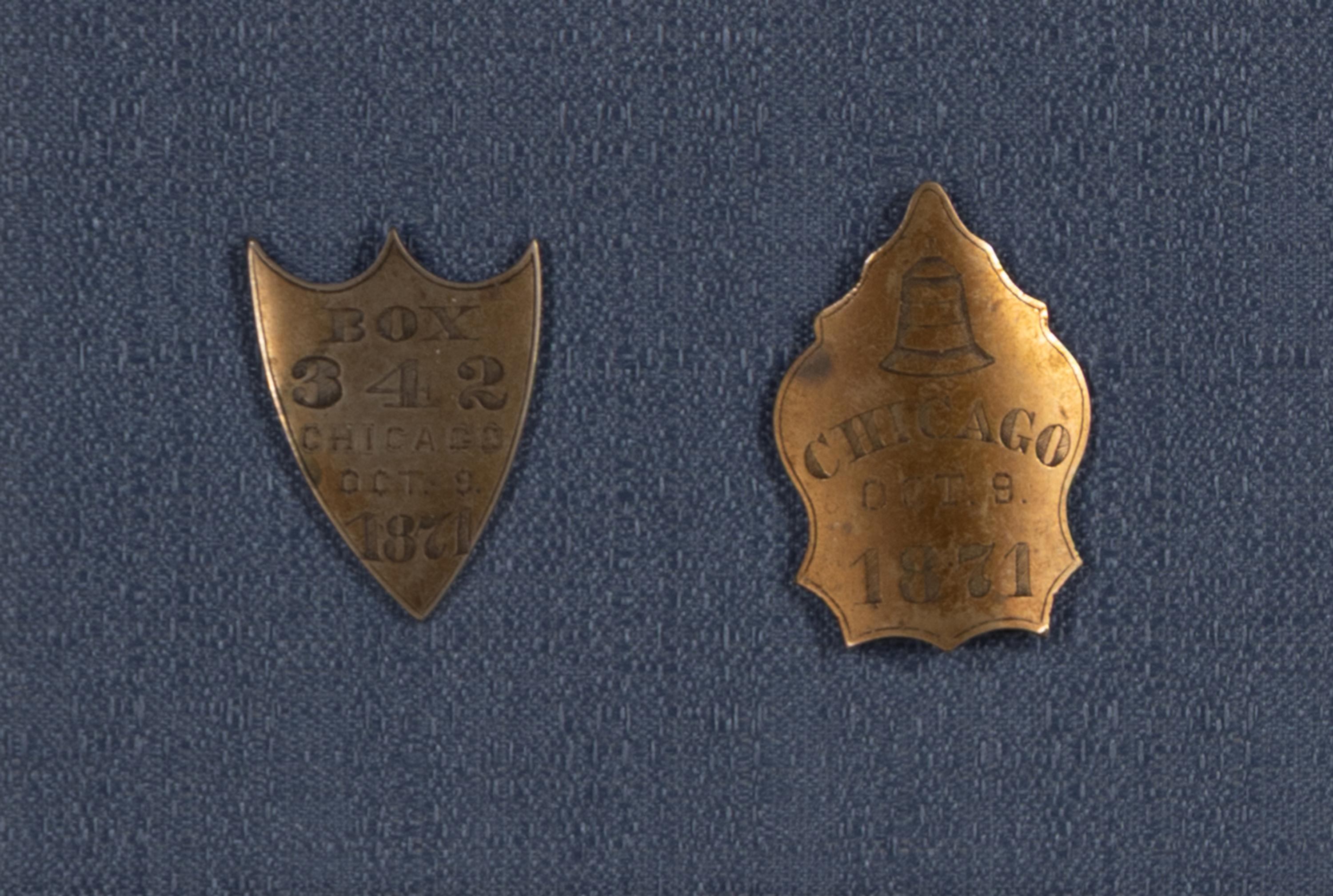 [Chicago Fire]. A pair of Chicago Fire bell badges, 1871.