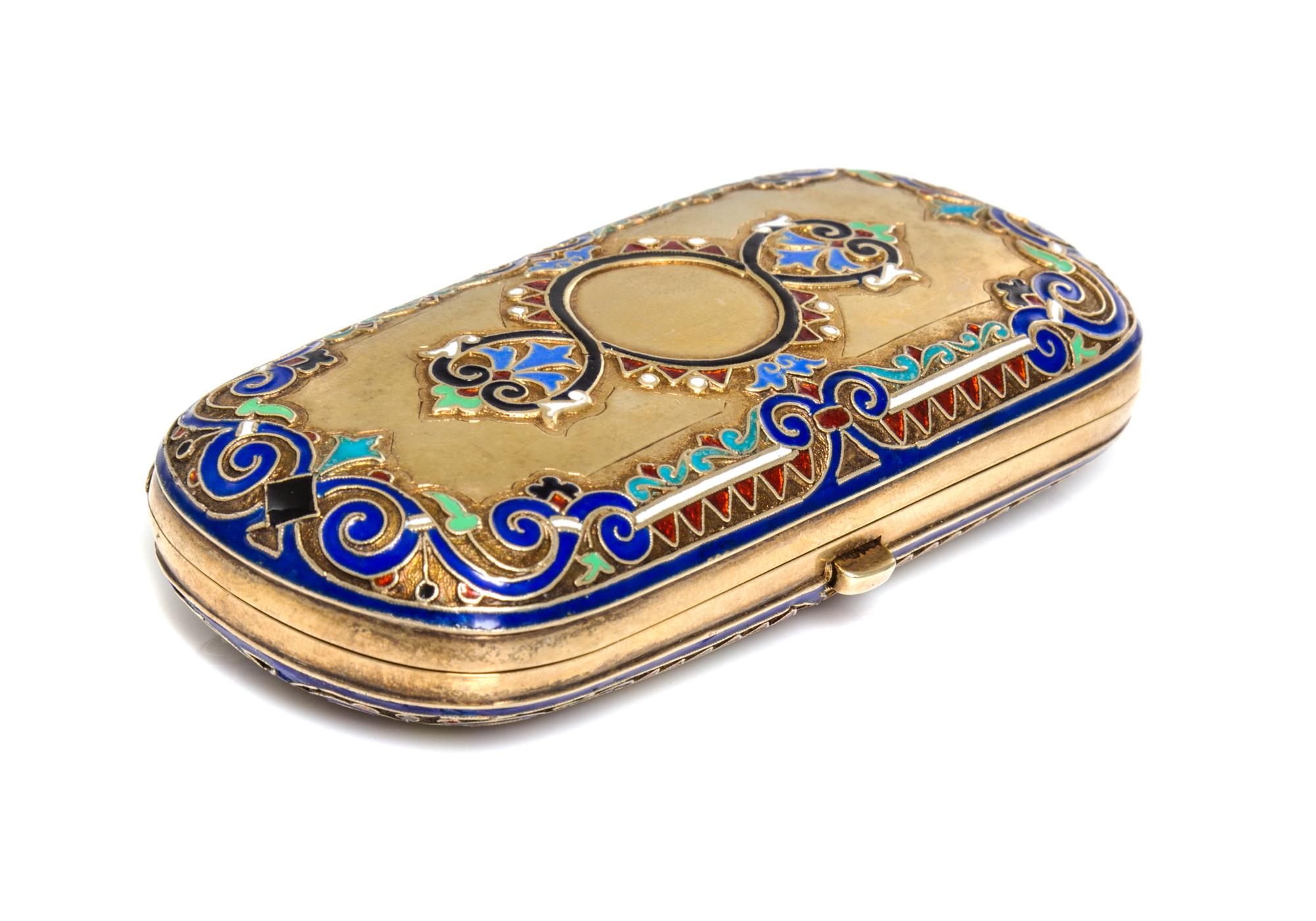 A Russian Enameled Silver-Gilt Cigarette Case, Moscow, 19th/20th Century, of rectangular form centered with a polychrome medallion.