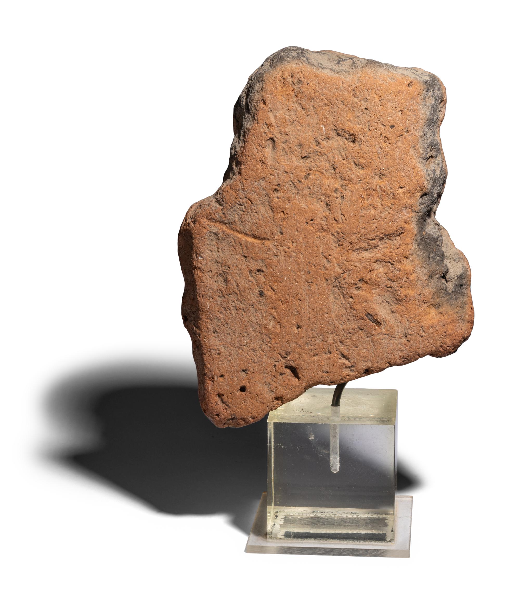 An Egyptian Terracotta Head of Bes