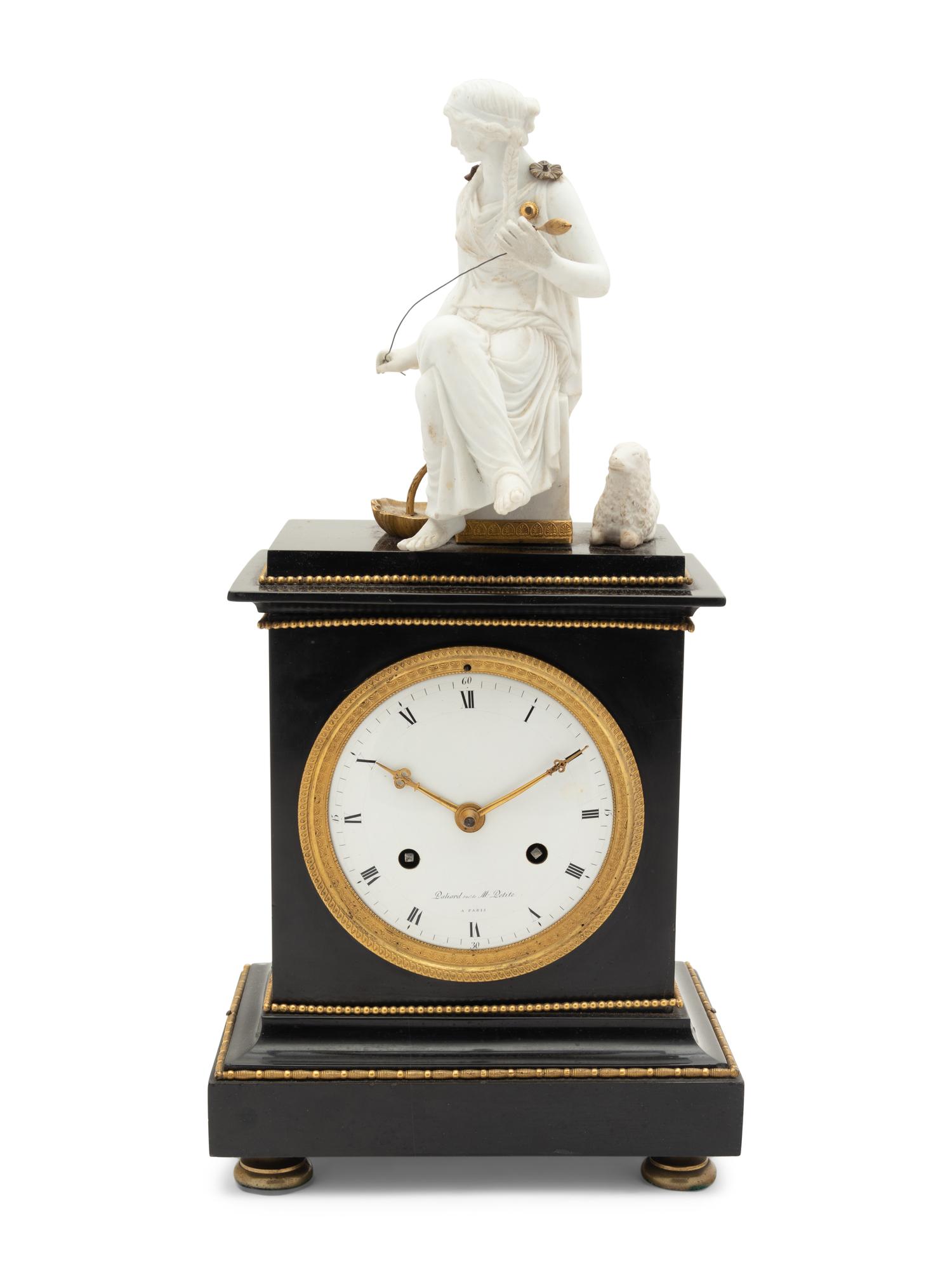 An Empire Gilt Metal Mounted Figural Mantel Clock