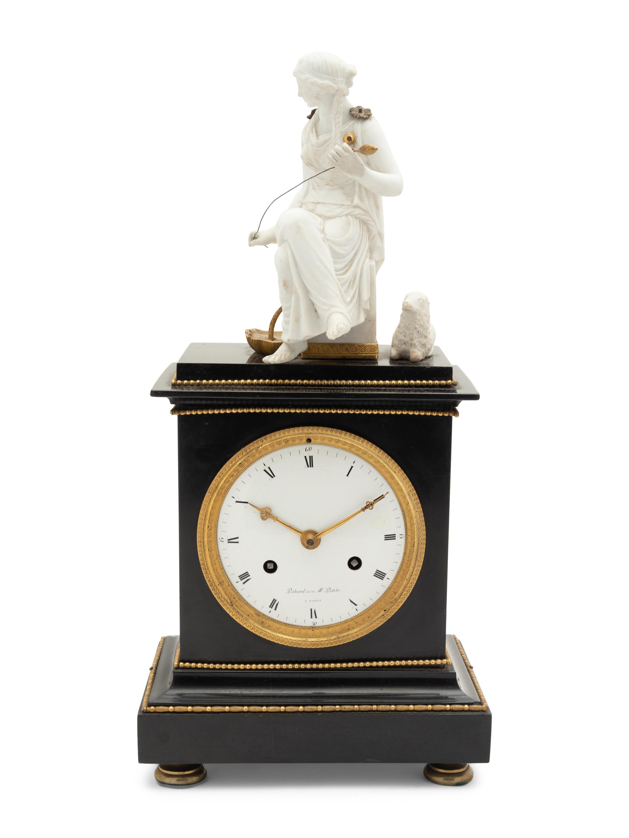 An Empire Gilt Metal Mounted Figural Mantel Clock