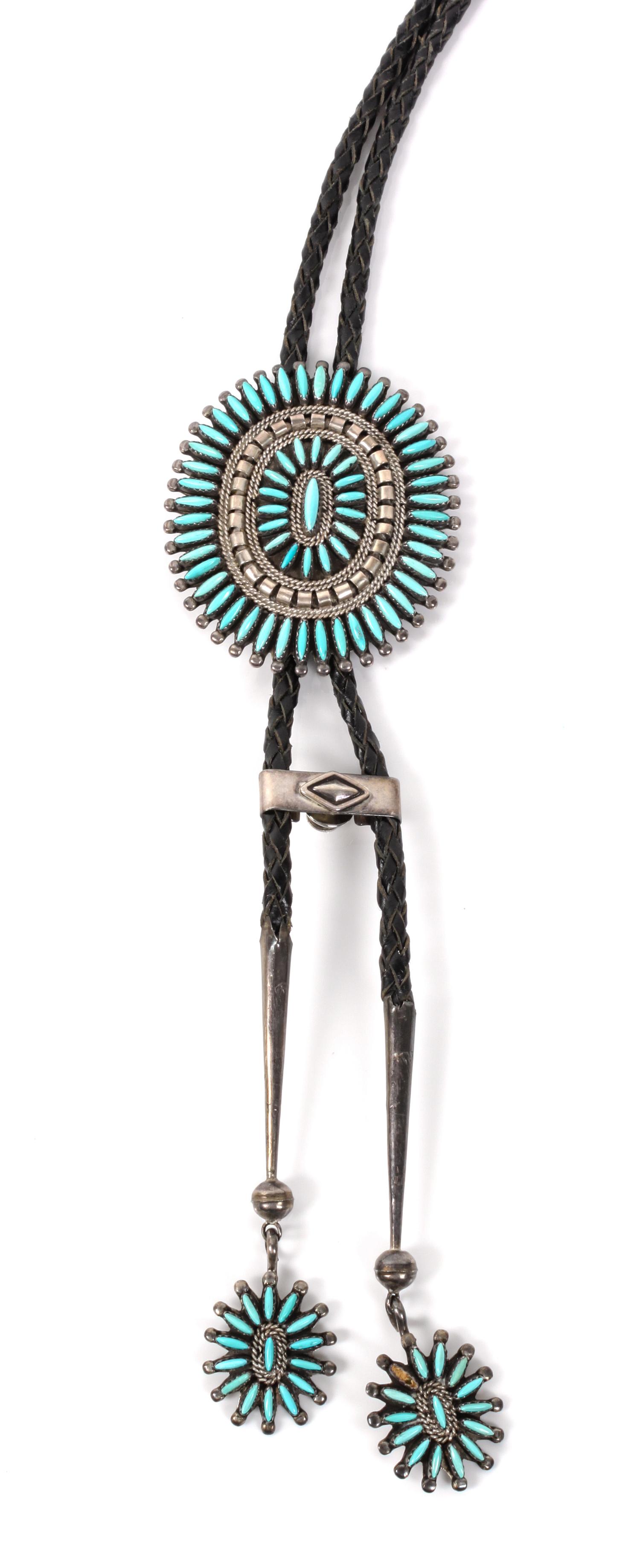 A Zuni Silver and Turquoise Petit Point Bolo Height 2 3/4 x width 2 3/8 inches.