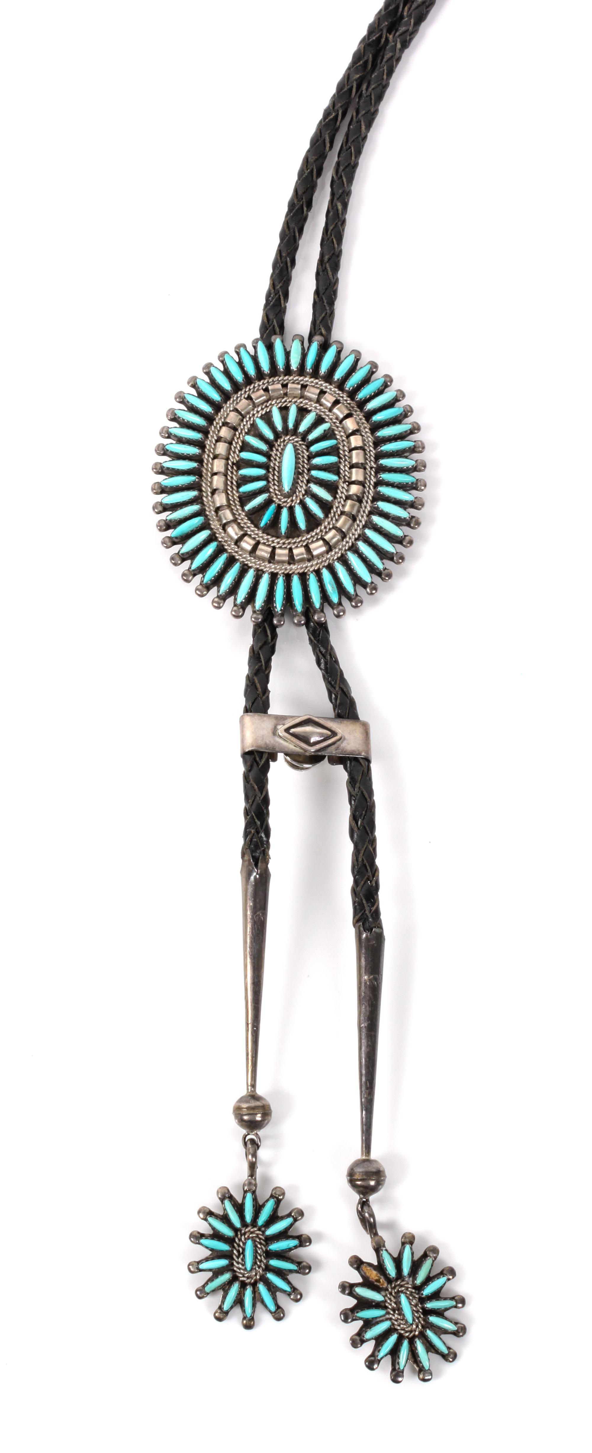 A Zuni Silver and Turquoise Petit Point Bolo Height 2 3/4 x width 2 3/8 inches.