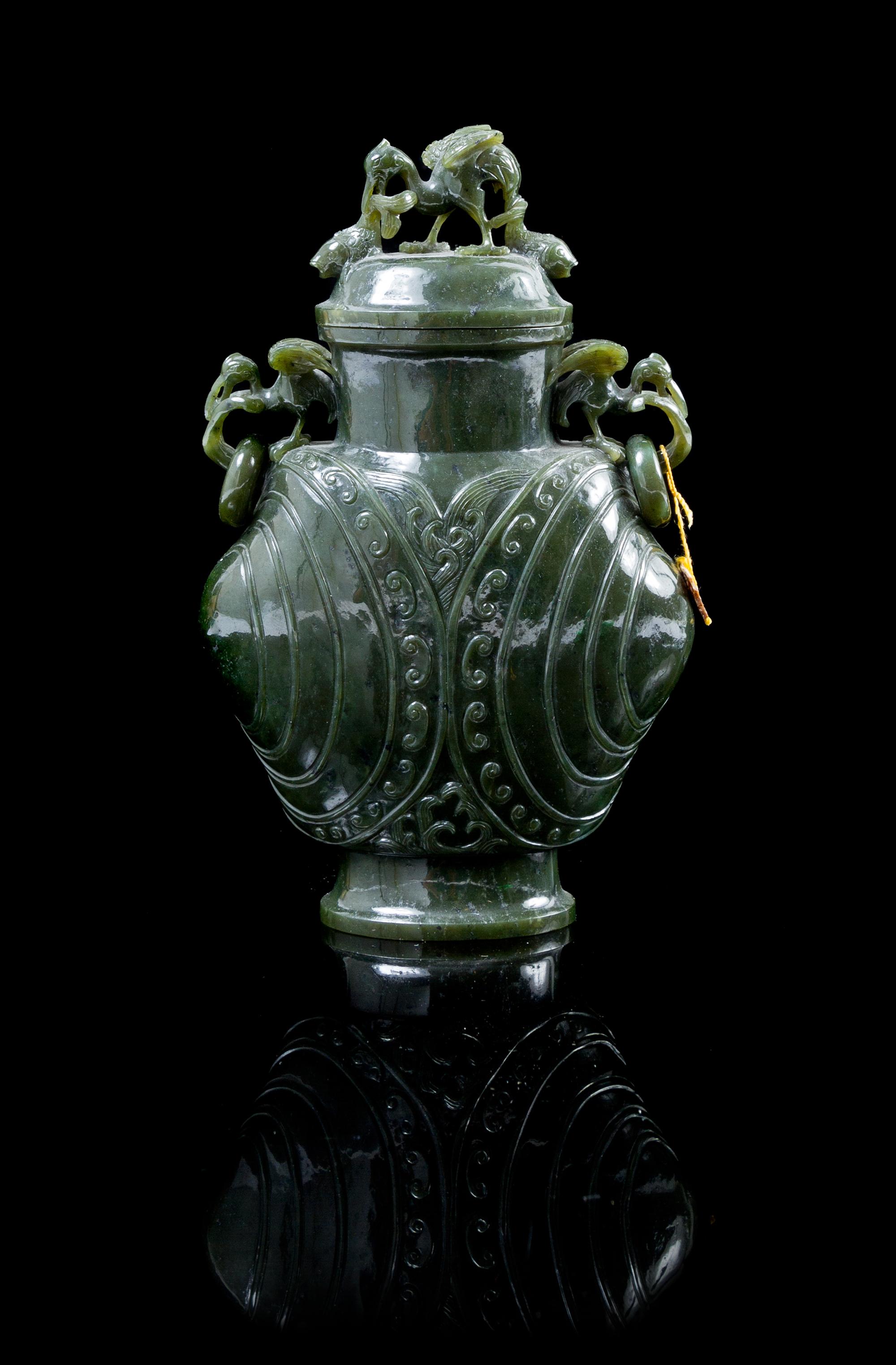 A Carved Spinach Jade Vase Height 7 1/4 inches.