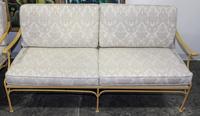 A Pair of Vintage Painted Iron Settees. Height 31 x width 69 x depth 31 1/2 inches.