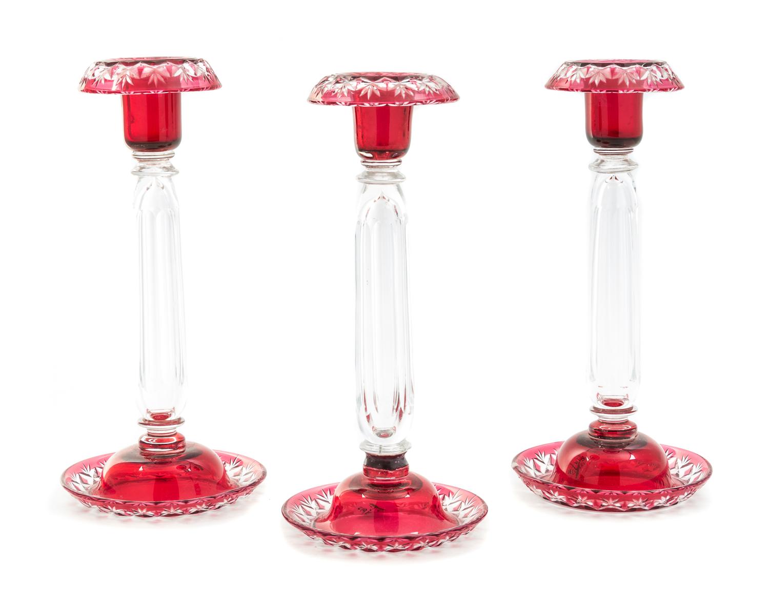 A Set of Three Bohemian Cut to Clear Glass Candlesticks Height 10 inches.
