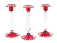 A Set of Three Bohemian Cut to Clear Glass Candlesticks Height 10 inches.