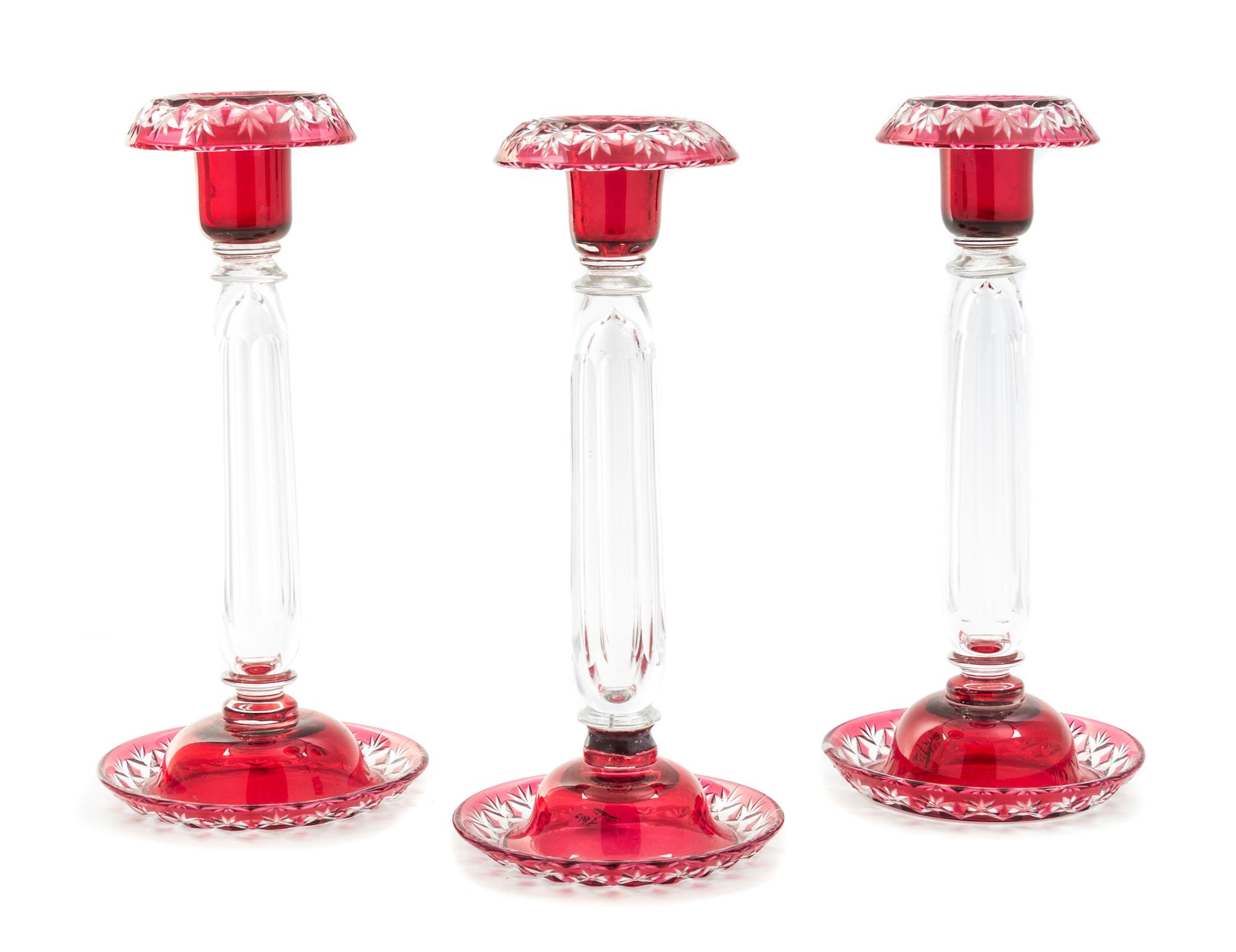 A Set of Three Bohemian Cut to Clear Glass Candlesticks Height 10 inches.