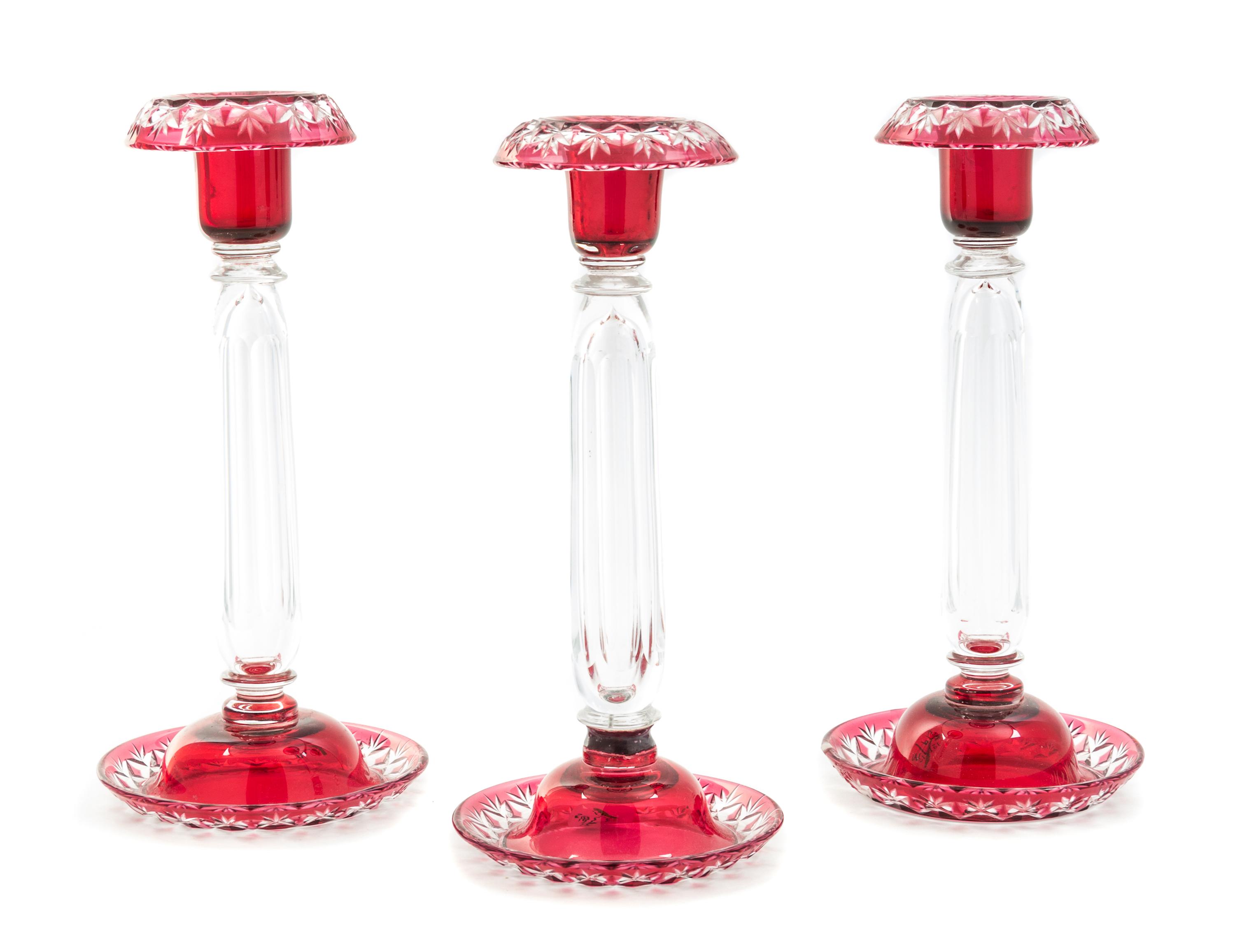 A Set of Three Bohemian Cut to Clear Glass Candlesticks Height 10 inches.