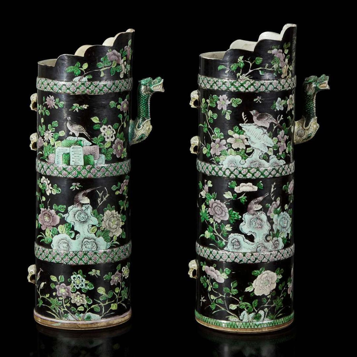 An associated pair of Chinese famille noir-decorated porcelain ceremonial ewers 黑地瓷胎画珐琅多穆壶两只 或为一对 Qing dynasty ?