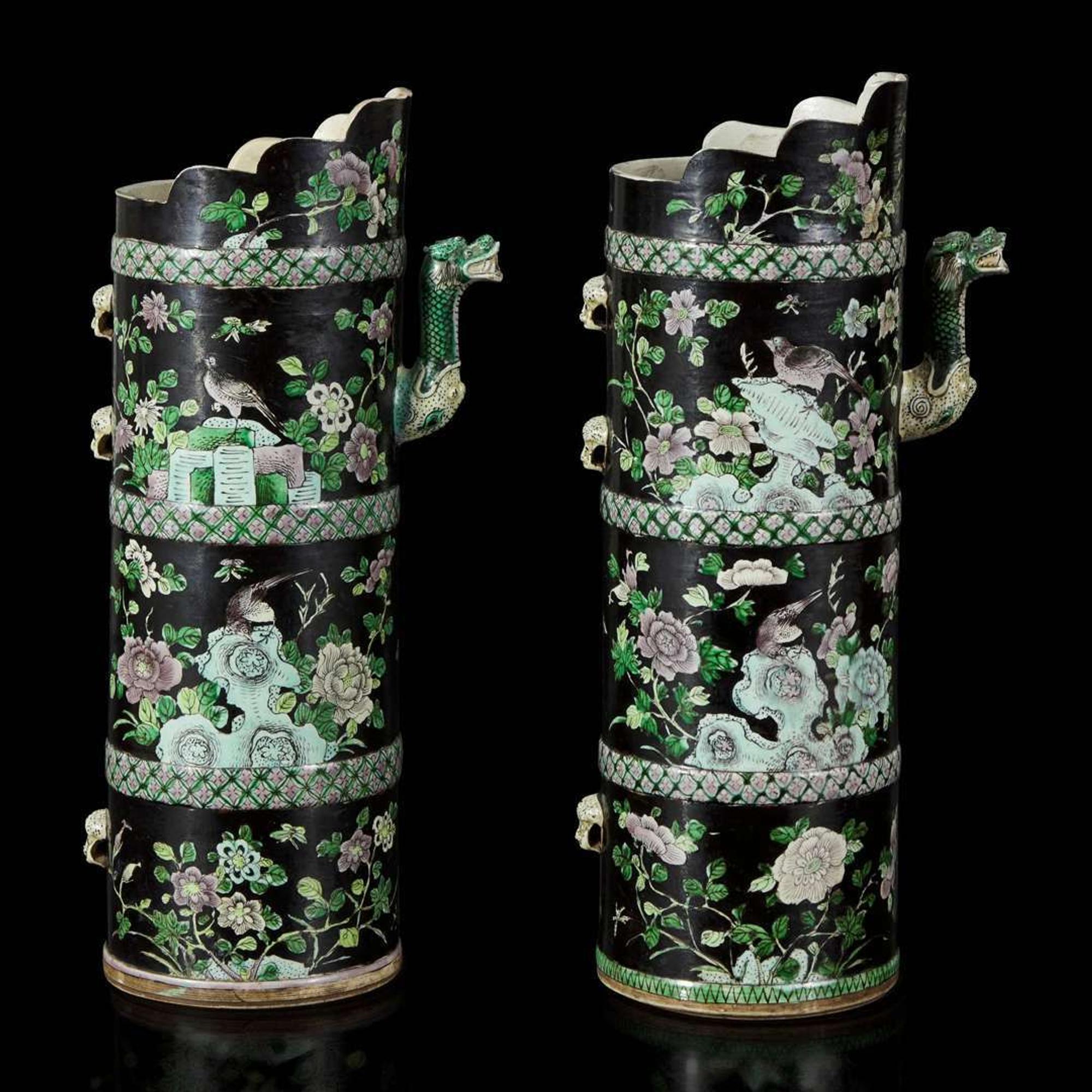 An associated pair of Chinese famille noir-decorated porcelain ceremonial ewers 黑地瓷胎画珐琅多穆壶两只 或为一对 Qing dynasty ?