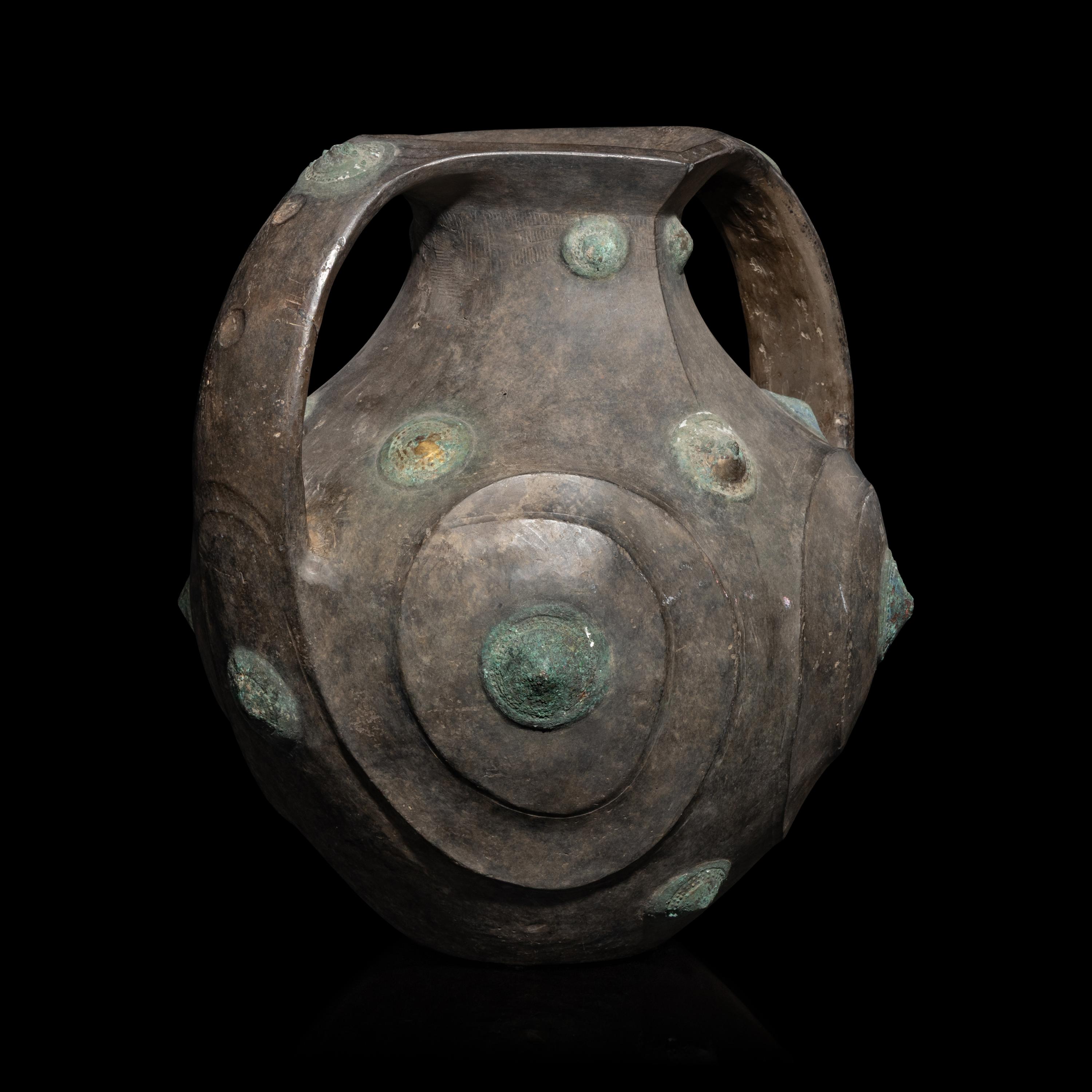 A Chinese Grey Pottery Amphora with Metal Boss Appliques, Western Han Dynasty — 西漢 黑陶嵌铜泡钉双耳壶