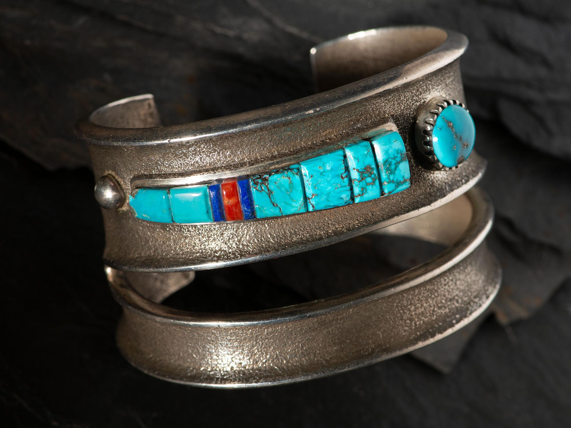 Tufa Cast Silver Cuff Bracelet, with Inlaid Abstract Figural Design