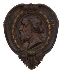 A Pair of Continental Carved Oak and Parcel Gilt Profile Plaques